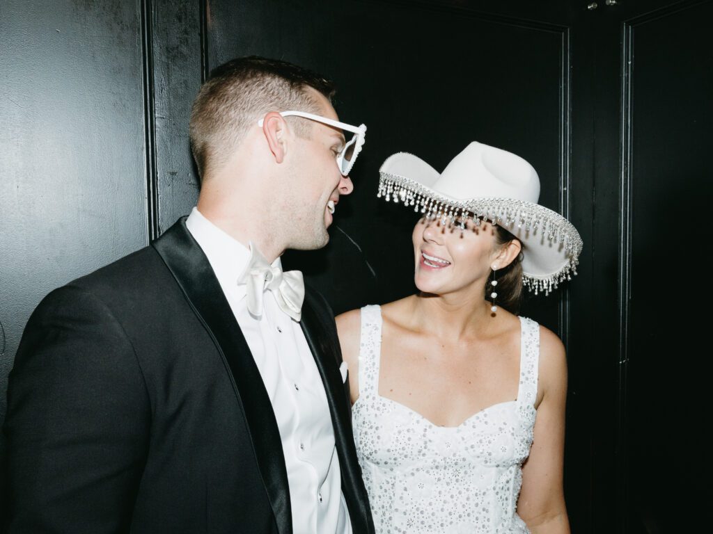 Bride in a blinged-out cowboy hat during the wedding reception at The Madison Club.