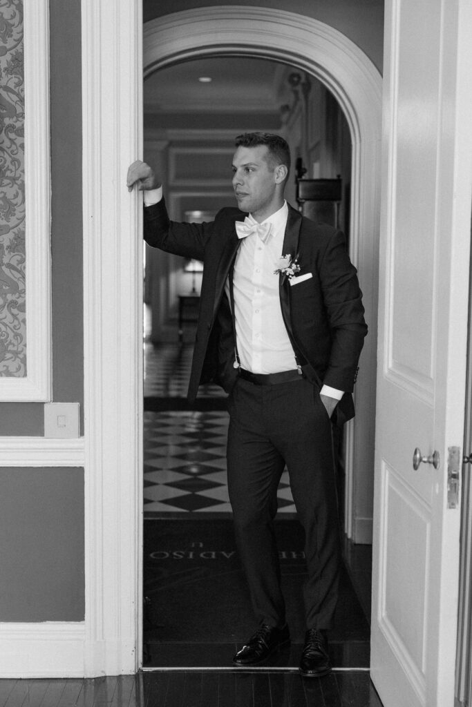 groom preparing for his wedding day at the madison club in Madison, WI