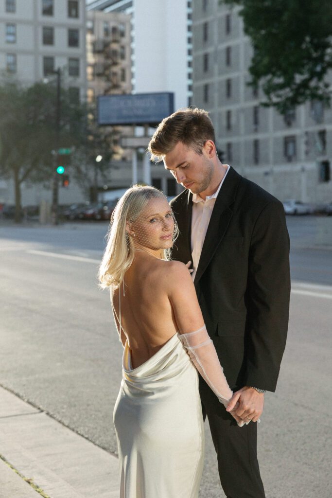 Romantic Milwaukee City Hall elopement during a warm, glowing sunset.