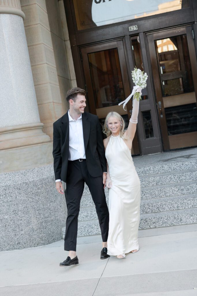 Romantic Milwaukee City Hall elopement with a bride and groom on the steps.