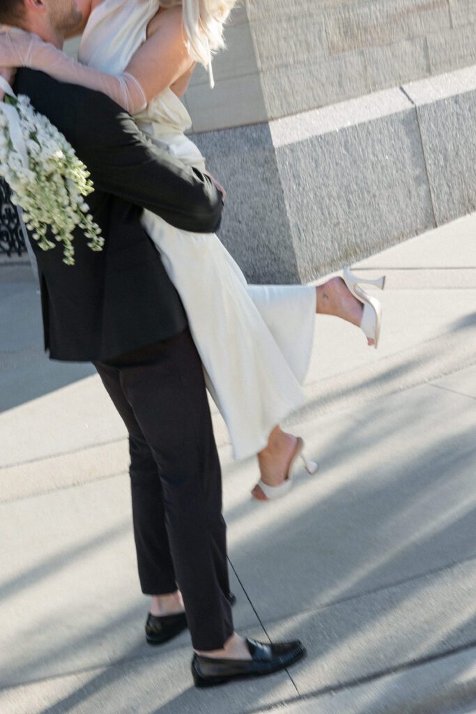 Bride and groom celebrate after their city hall elopement.