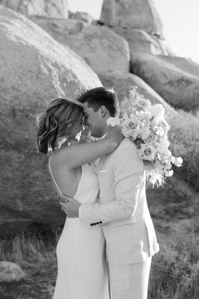 Dreamy desert elopement with bride and groom in Joshua Tree by Mariah Jones Photo wedding dress neutral florals documentary