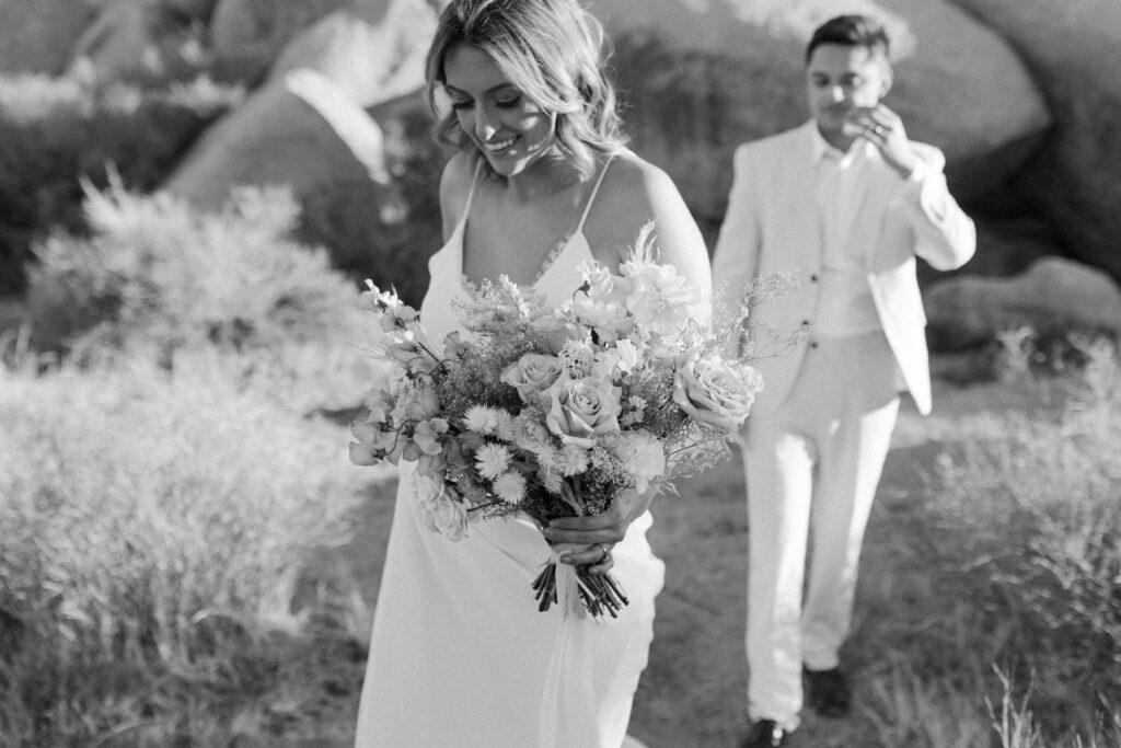 Dreamy desert elopement with bride and groom in Joshua Tree by Mariah Jones Photo wedding dress neutral florals documentary