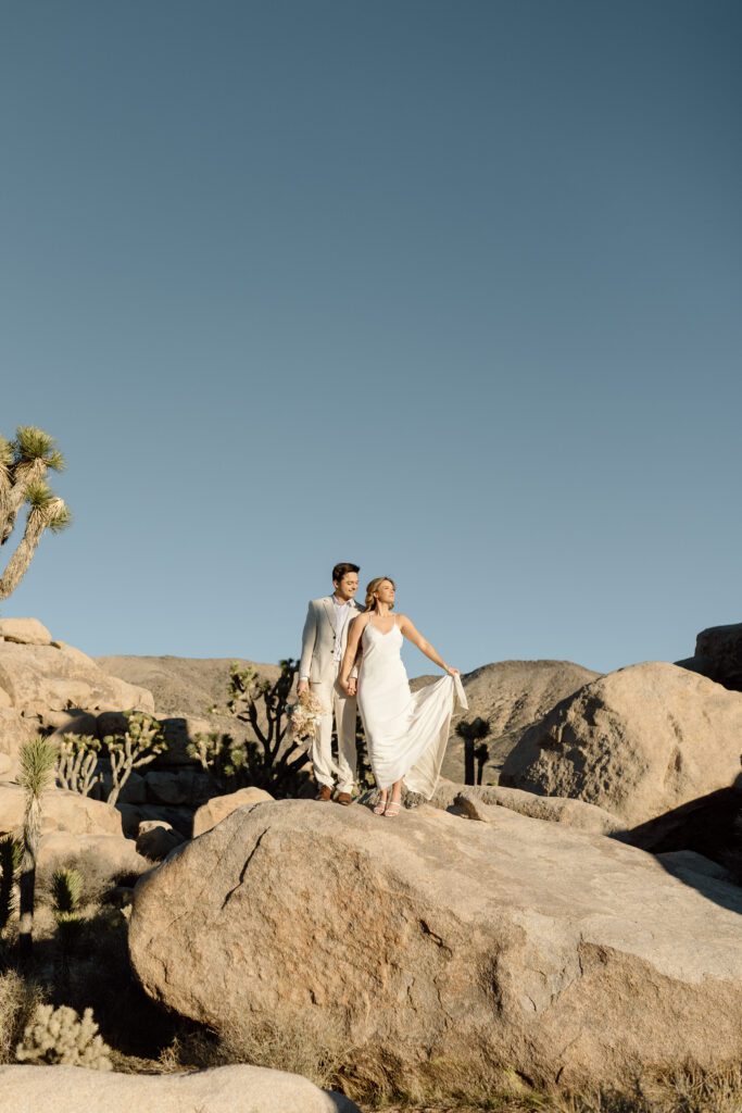 Dreamy desert elopement with bride and groom in Joshua Tree by Mariah Jones Photo wedding dress neutral florals documentary