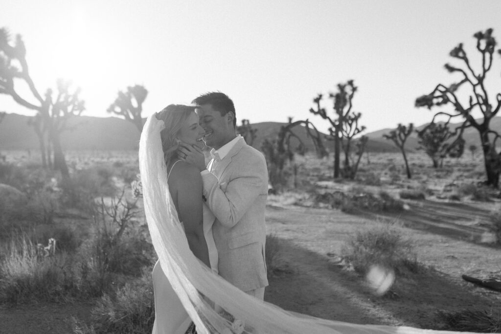 Dreamy desert elopement with bride and groom in Joshua Tree by Mariah Jones Photo wedding dress neutral florals documentary