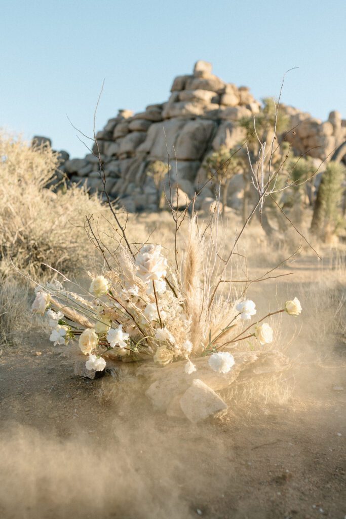 Dreamy desert elopement with bride and groom in Joshua Tree by Mariah Jones Photo wedding dress neutral florals documentary