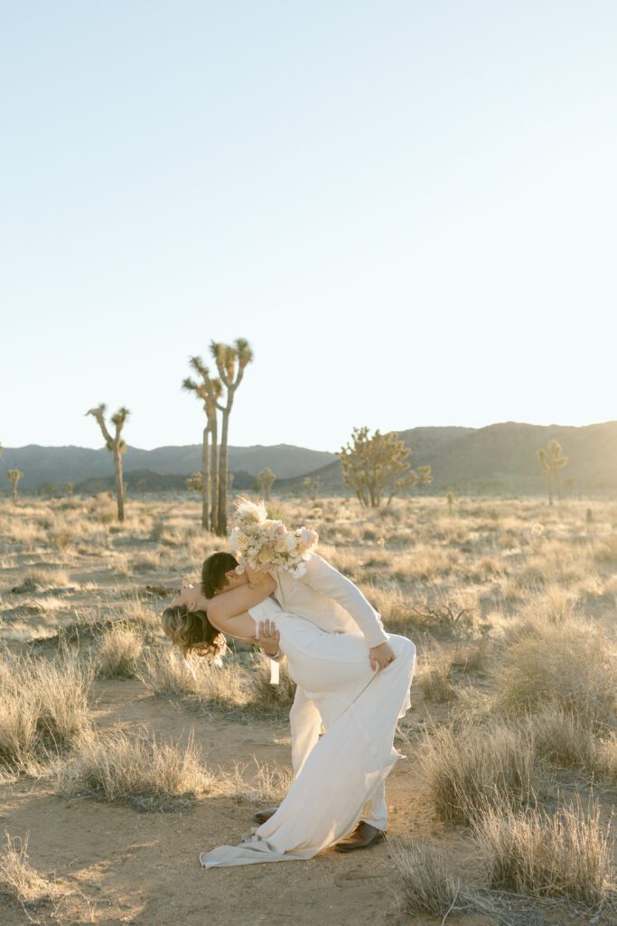 Dreamy desert elopement with bride and groom in Joshua Tree by Mariah Jones Photo wedding dress neutral florals documentary