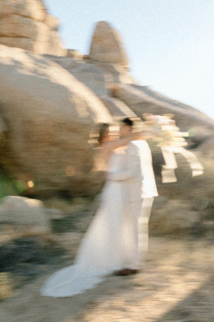 Dreamy desert elopement with bride and groom in Joshua Tree by Mariah Jones Photo wedding dress neutral florals documentary