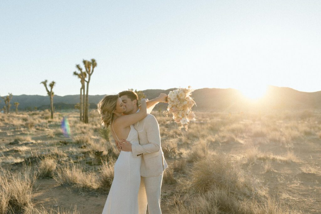 Dreamy desert elopement with bride and groom in Joshua Tree by Mariah Jones Photo wedding dress neutral florals documentary