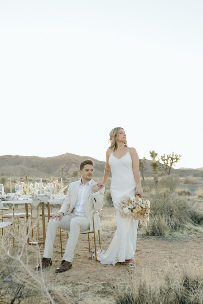 Dreamy desert elopement with bride and groom in Joshua Tree by Mariah Jones Photo wedding dress neutral florals documentary