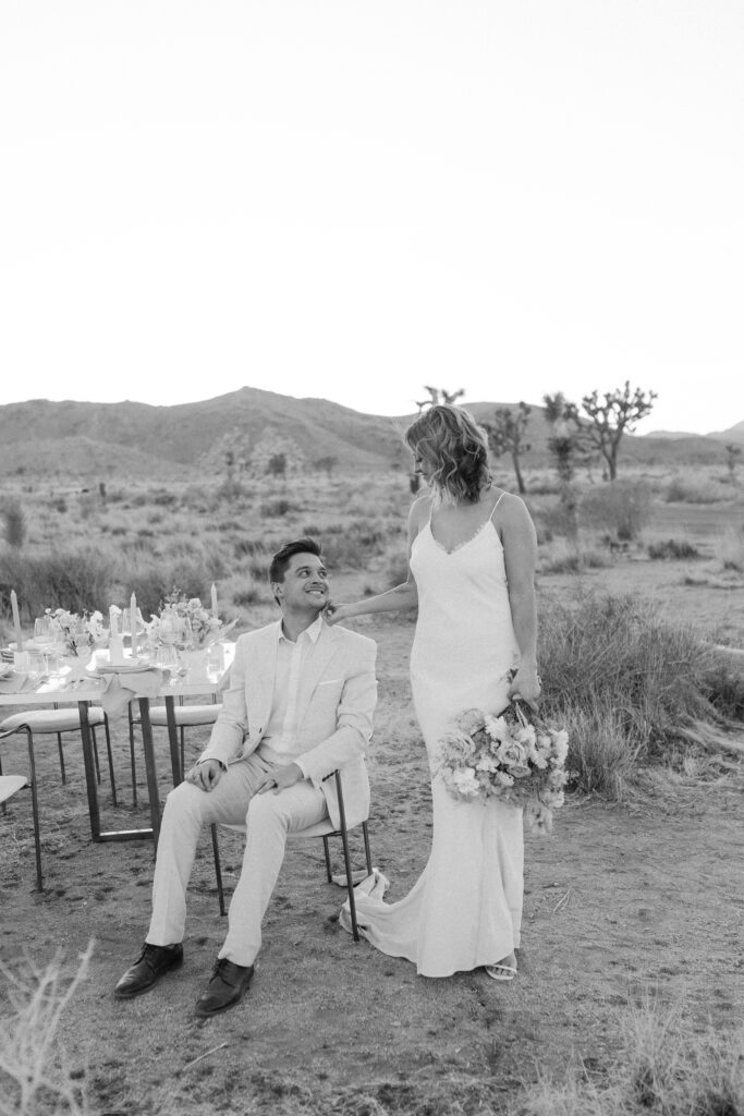 Dreamy desert elopement with bride and groom in Joshua Tree by Mariah Jones Photo wedding dress neutral florals documentary