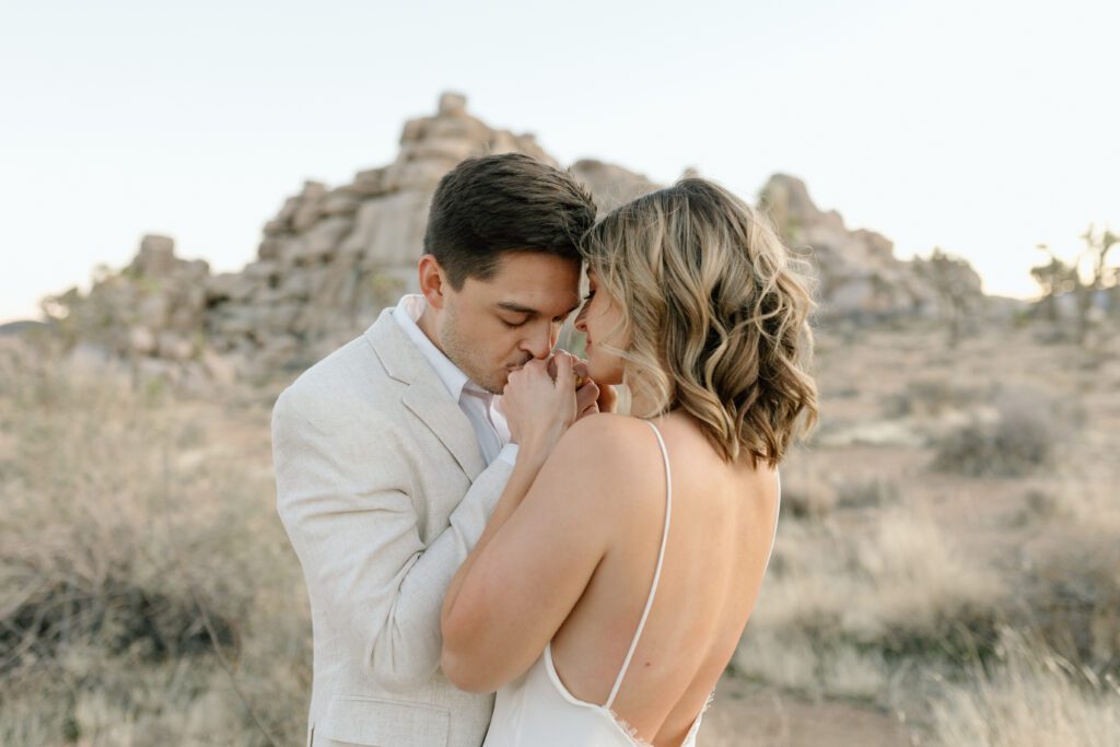 Dreamy desert elopement with bride and groom in Joshua Tree by Mariah Jones Photo wedding dress neutral florals documentary