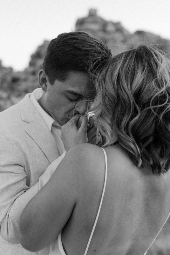 Dreamy desert elopement with bride and groom in Joshua Tree by Mariah Jones Photo wedding dress neutral florals documentary