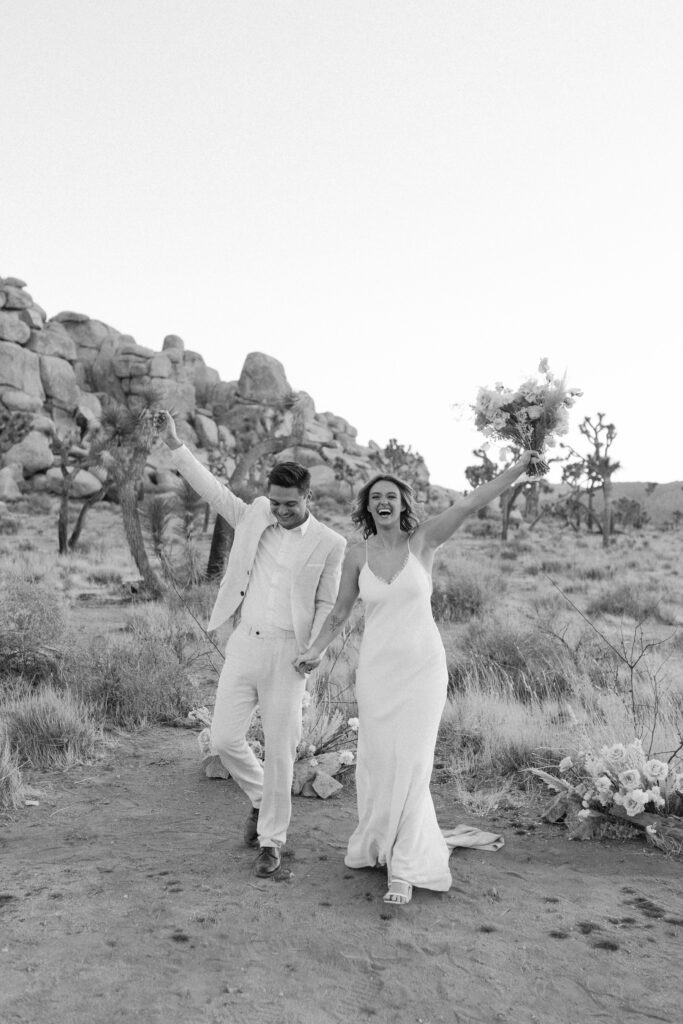 Dreamy desert elopement with bride and groom in Joshua Tree by Mariah Jones Photo wedding dress neutral florals documentary