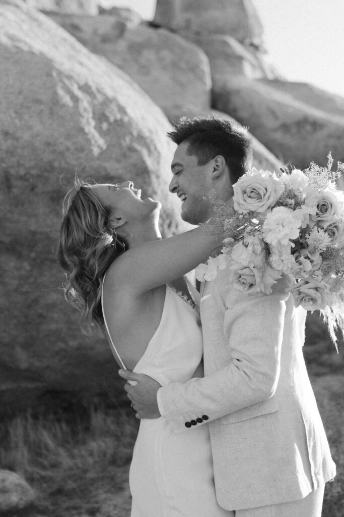 Dreamy desert elopement with bride and groom in Joshua Tree by Mariah Jones Photo wedding dress neutral florals documentary