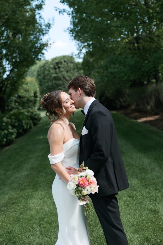 Bride and groom embracing each other at their Villa Terrace wedding.