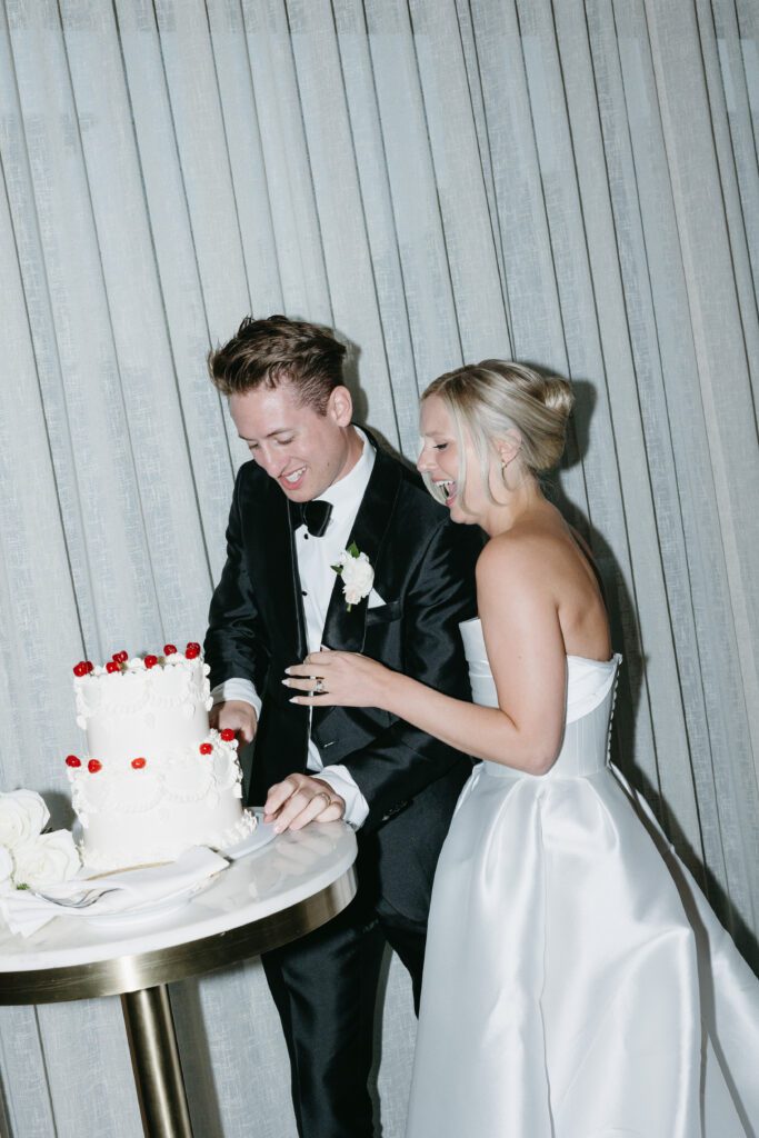 bride and groom cake cut at The George and Madcap Lounge