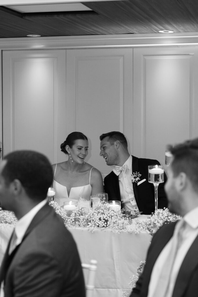 bride and groom during speeches at The Madison Club at their wedding reception.