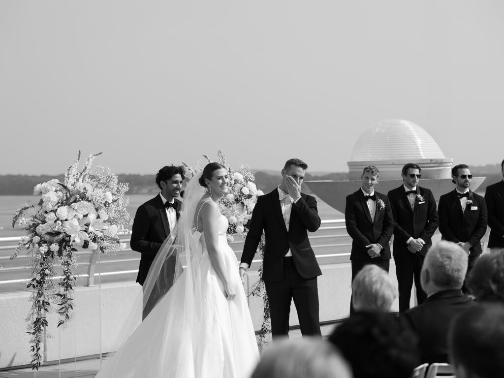 Candid moment of the bride and groom emotional during their outdoor ceremony