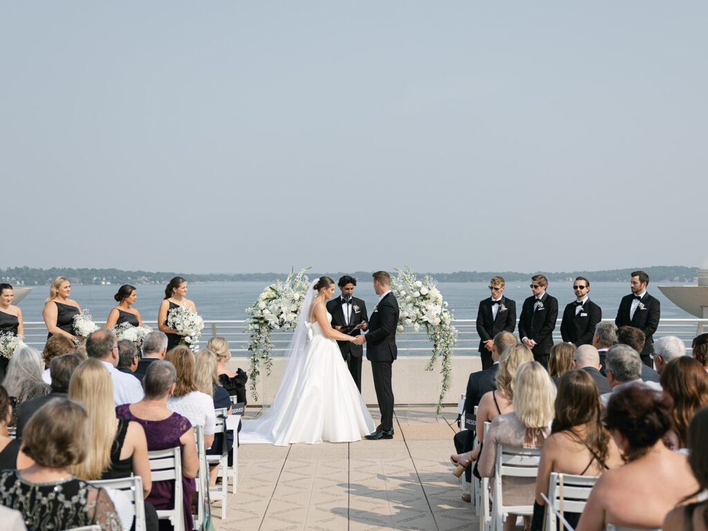 Lake Monona ceremony setup at The Monona Terrace with views of the water.