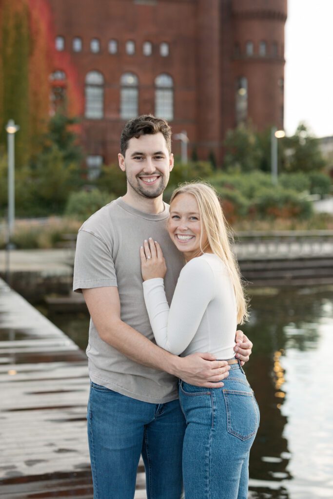 Couple poses for a natural portrait on the lake near the Memorial Union.