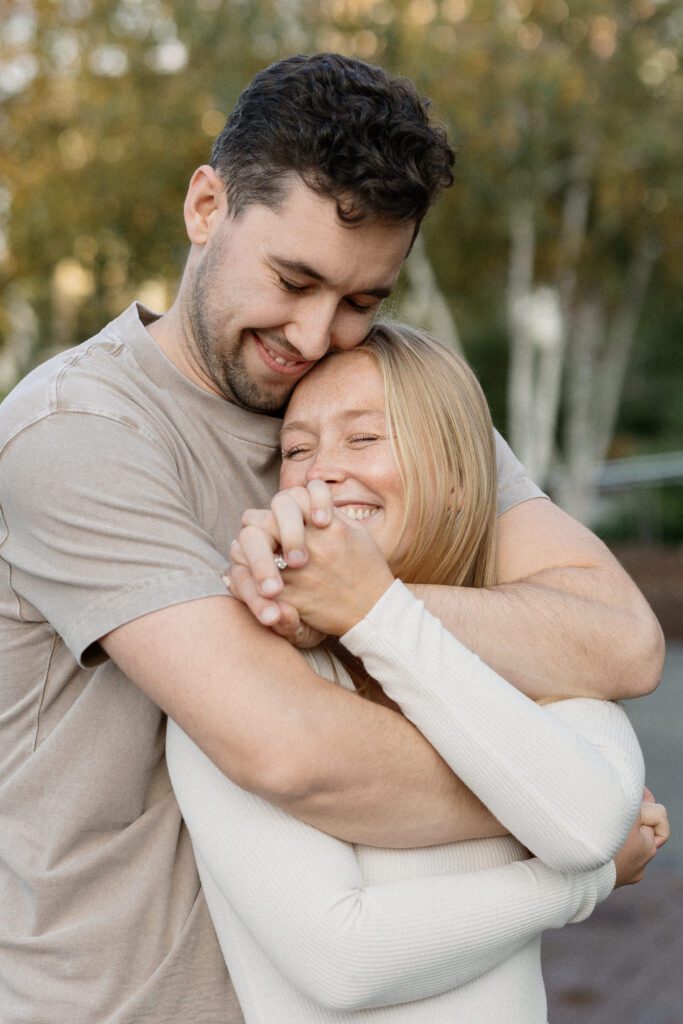 Couple smitten with love at the engagement session in Madison.