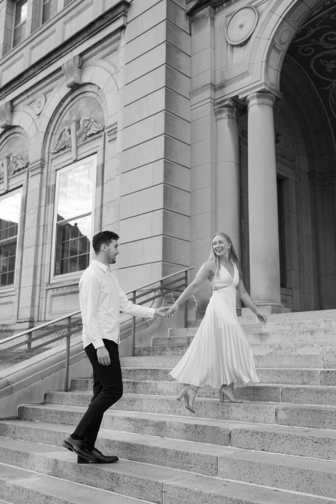 Couple walking up the steps at the front of the Memorial Union.