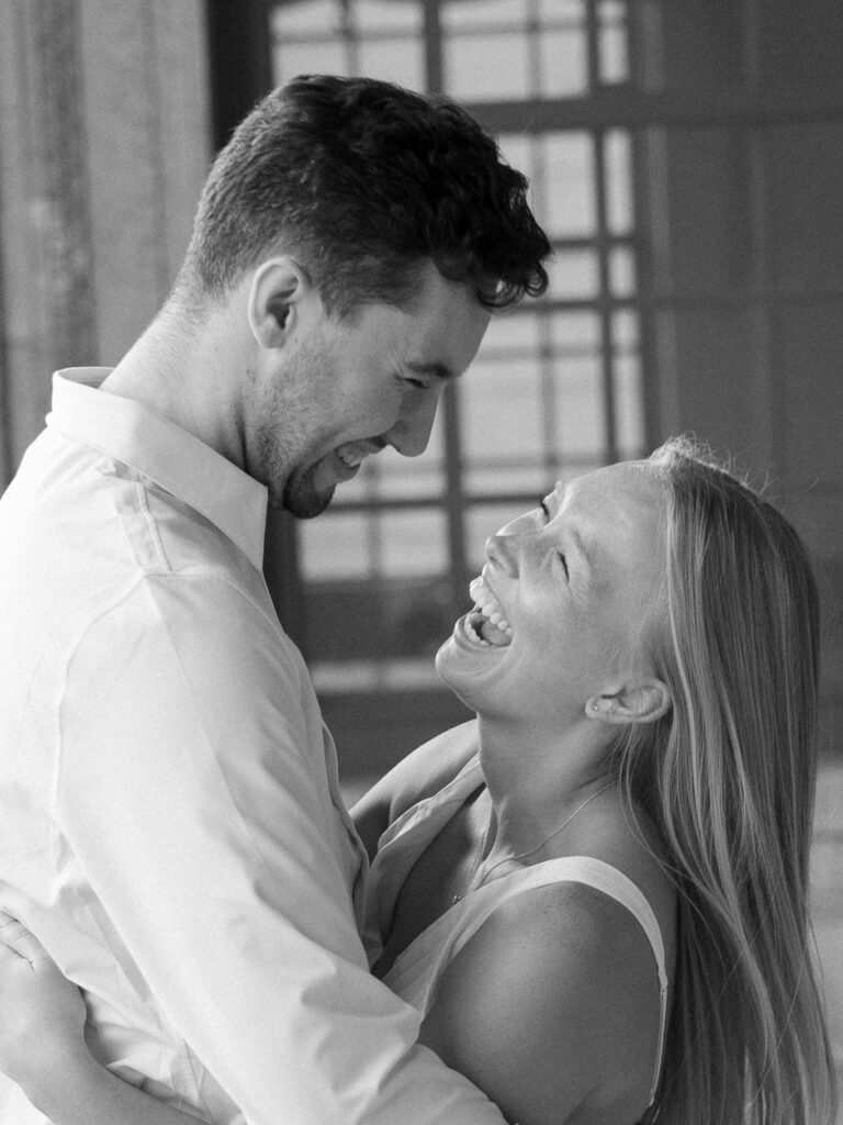 Close up of engaged couple laughing at the Memorial Union