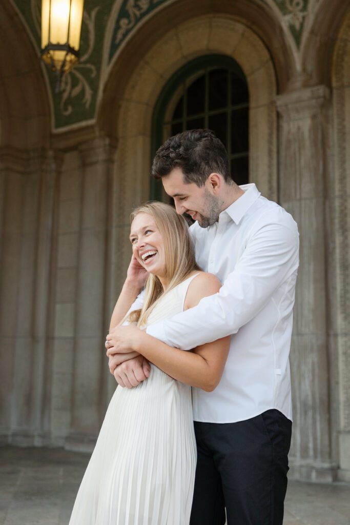 Couple laughing at their engagement session in Madison.