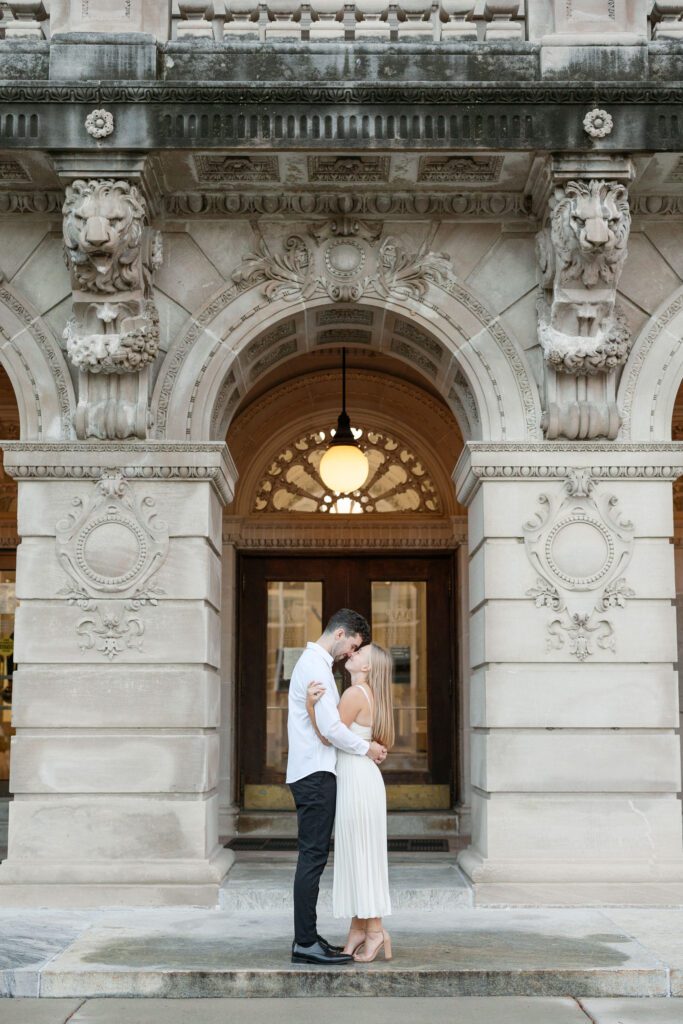 Couple holding each other tightly with smiles on their faces.