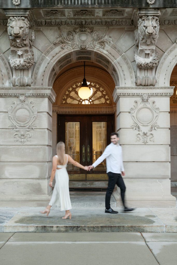 Blurry artistic photo of the couple walking by each other during their Memorial Union engagement session.