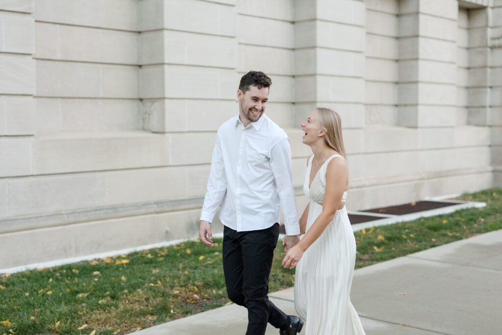 Engaged couple sharing a sweet moment while walking together.