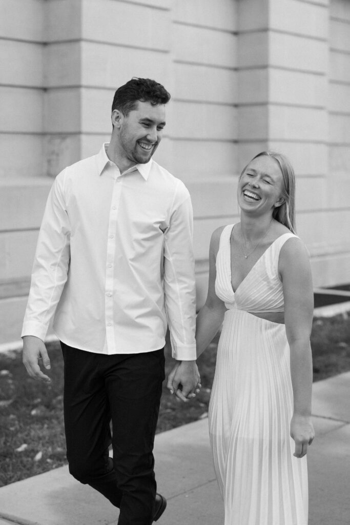 Black and white close up of a couple sharing a laugh at the engagement session.