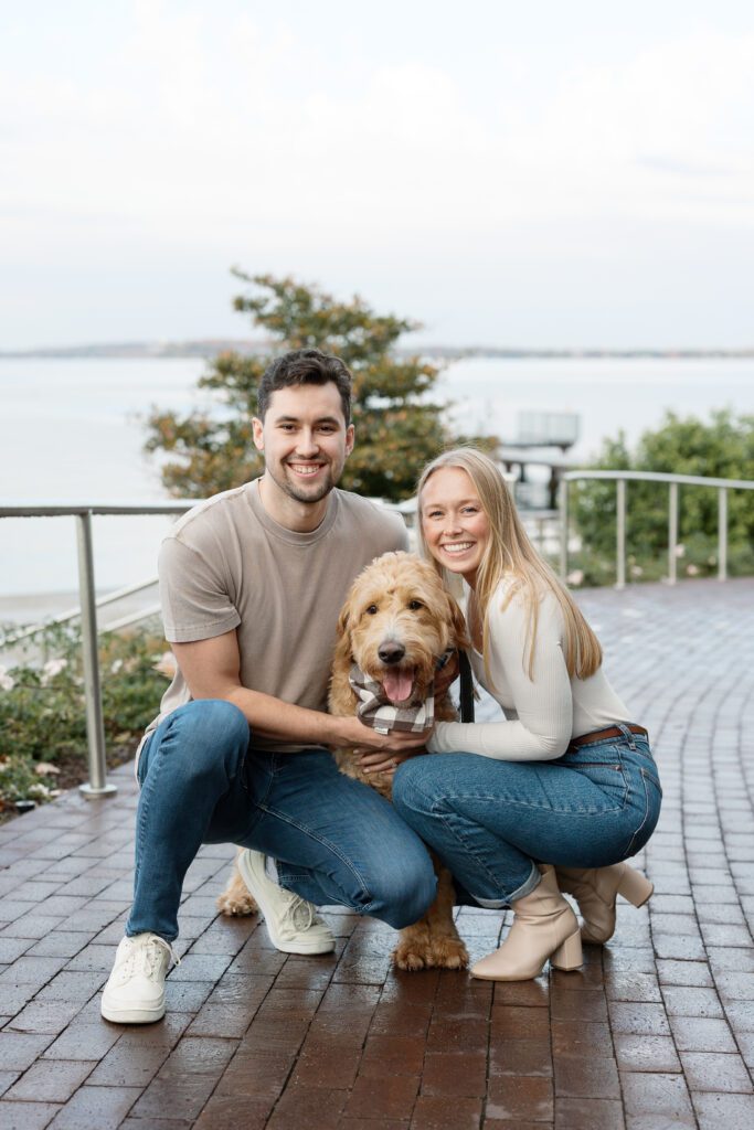 Couple hugging their dog in Madison at their engagement session.