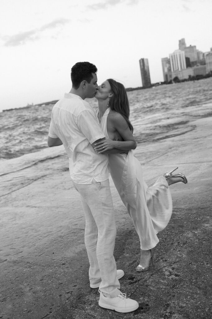 Couple kissing with tilted horizon at North Avenue Beach.