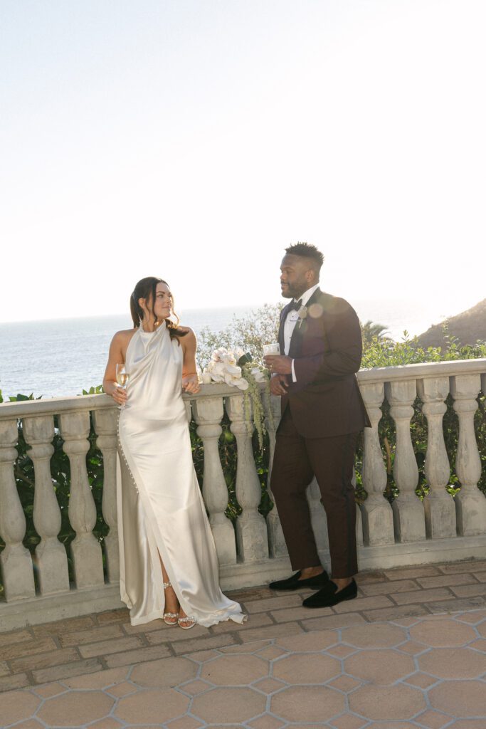 Romantic golden-hour portraits of the newlyweds at their Bel Air Bay Club wedding overlooking the cliffs.