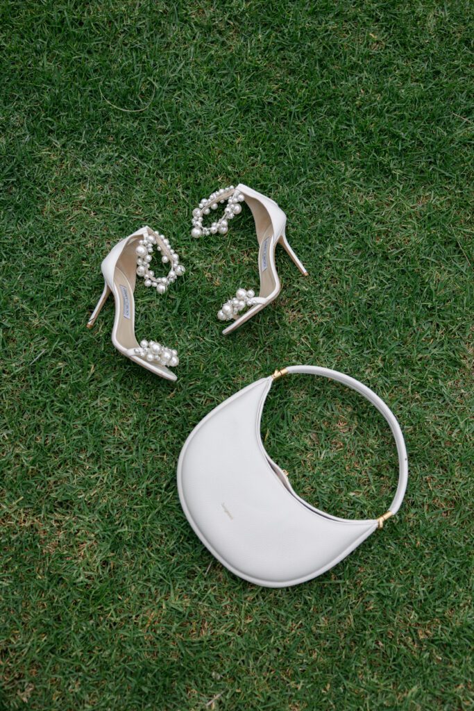 Bridal wedding accessories and details on the lawn at the Bel Air Bay Club.