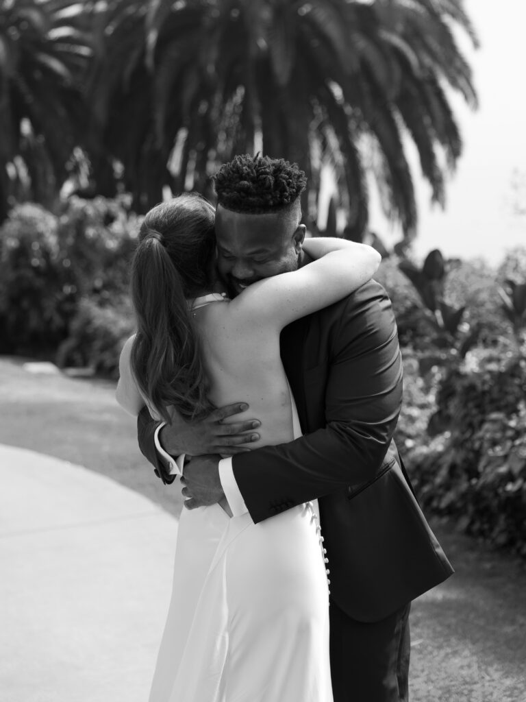 Black and white close up portrait of a couple embracing at their Bel Air Bay Club wedding in Los Angeles.