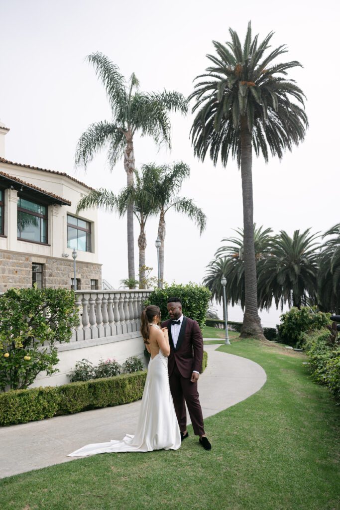 Bride and groom share their first look on the terrace at the Bel Air Bay Club.