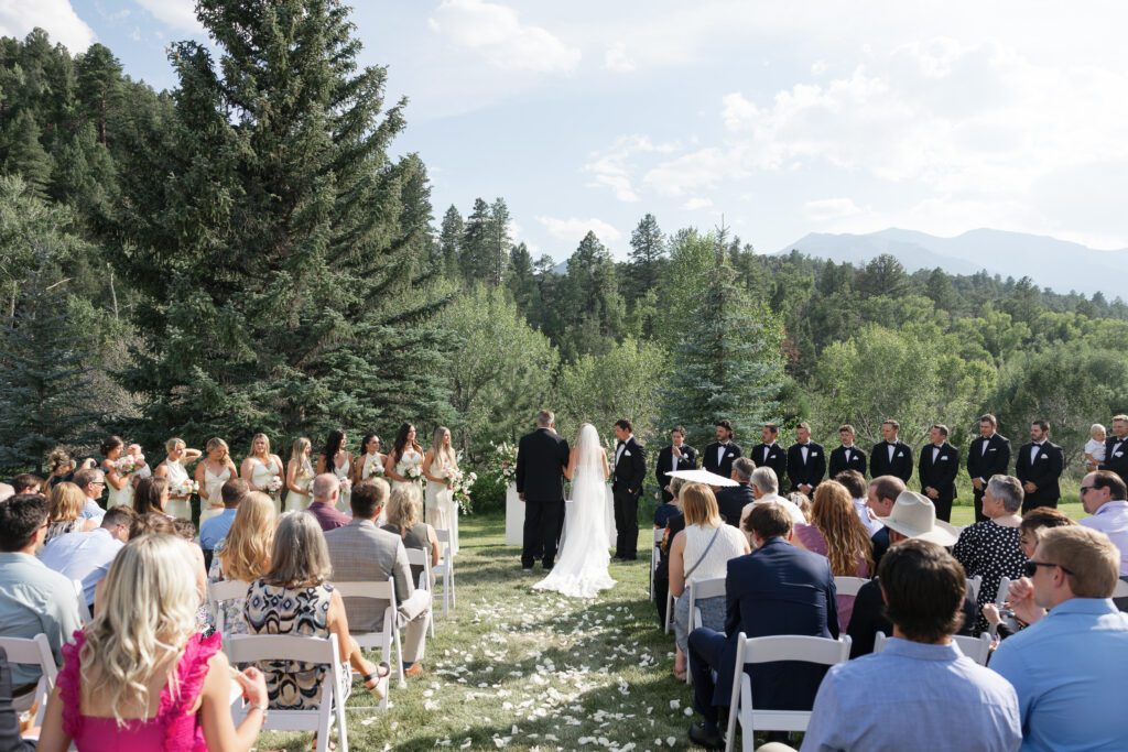 Guests seated outdoors during summer Mt. Princeton Hot Springs wedding ceremony