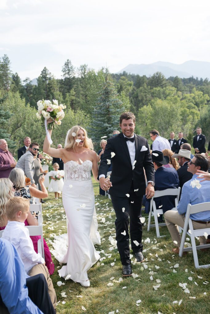 Just married couple walking up the aisle after ceremony at Mt. Princeton Hot Springs wedding